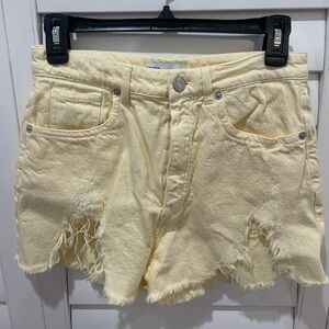 Pastel yellow denim shorts